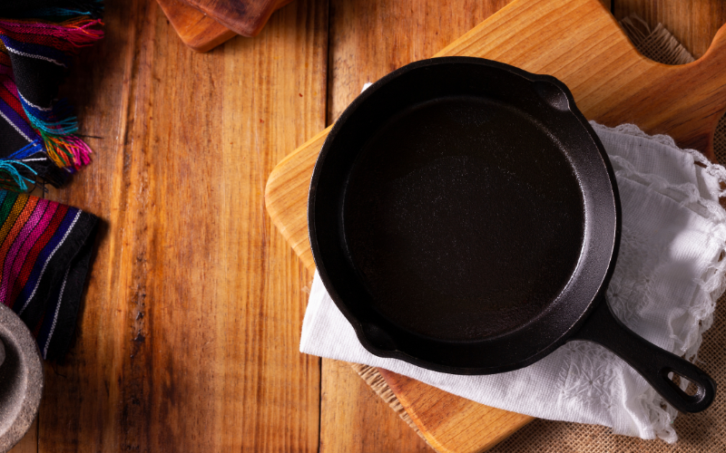 Shiny seasoned cast iron pan with oil coating
